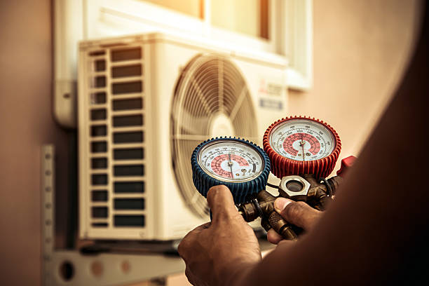 Professional Heat Pump Repair technician working in Tavernier, FL